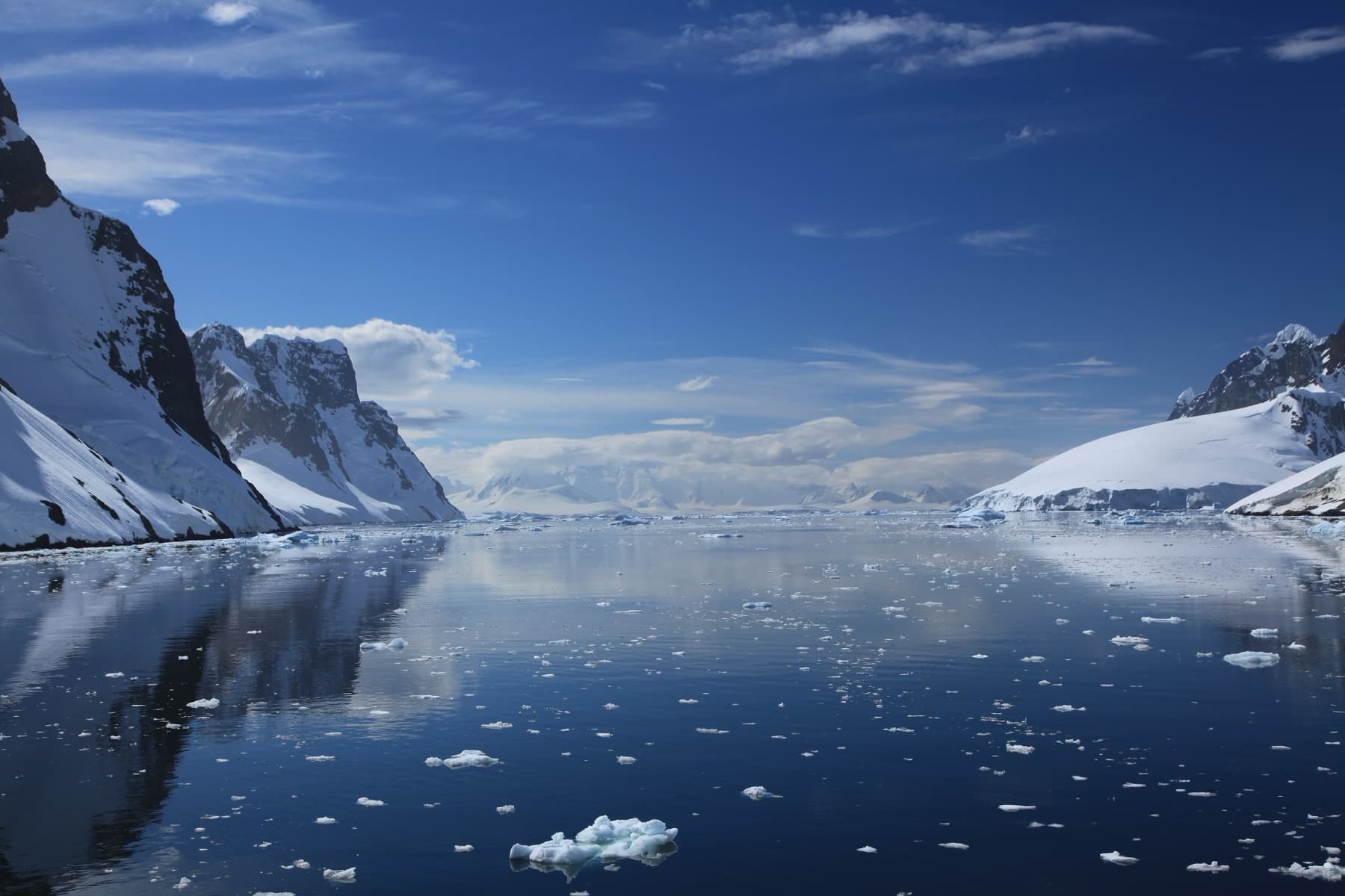 Ice and snowbound peaks along a narrow Antarctic channel