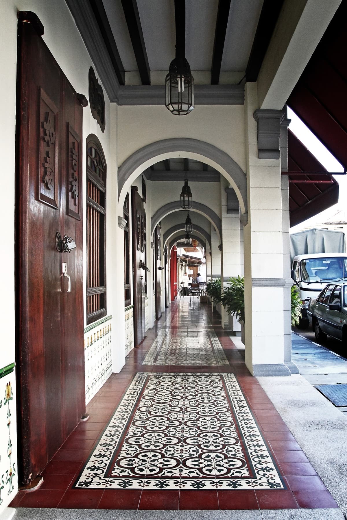 Covered five-foot way with tiled floors and hanging lanterns in George Town, Penang