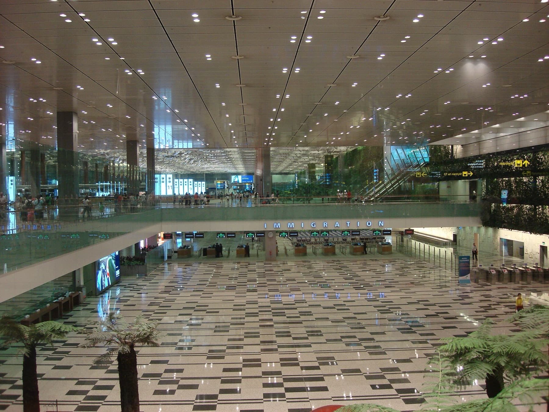 Immigration hall and green wall inside Singapore Changi Airport Terminal 3