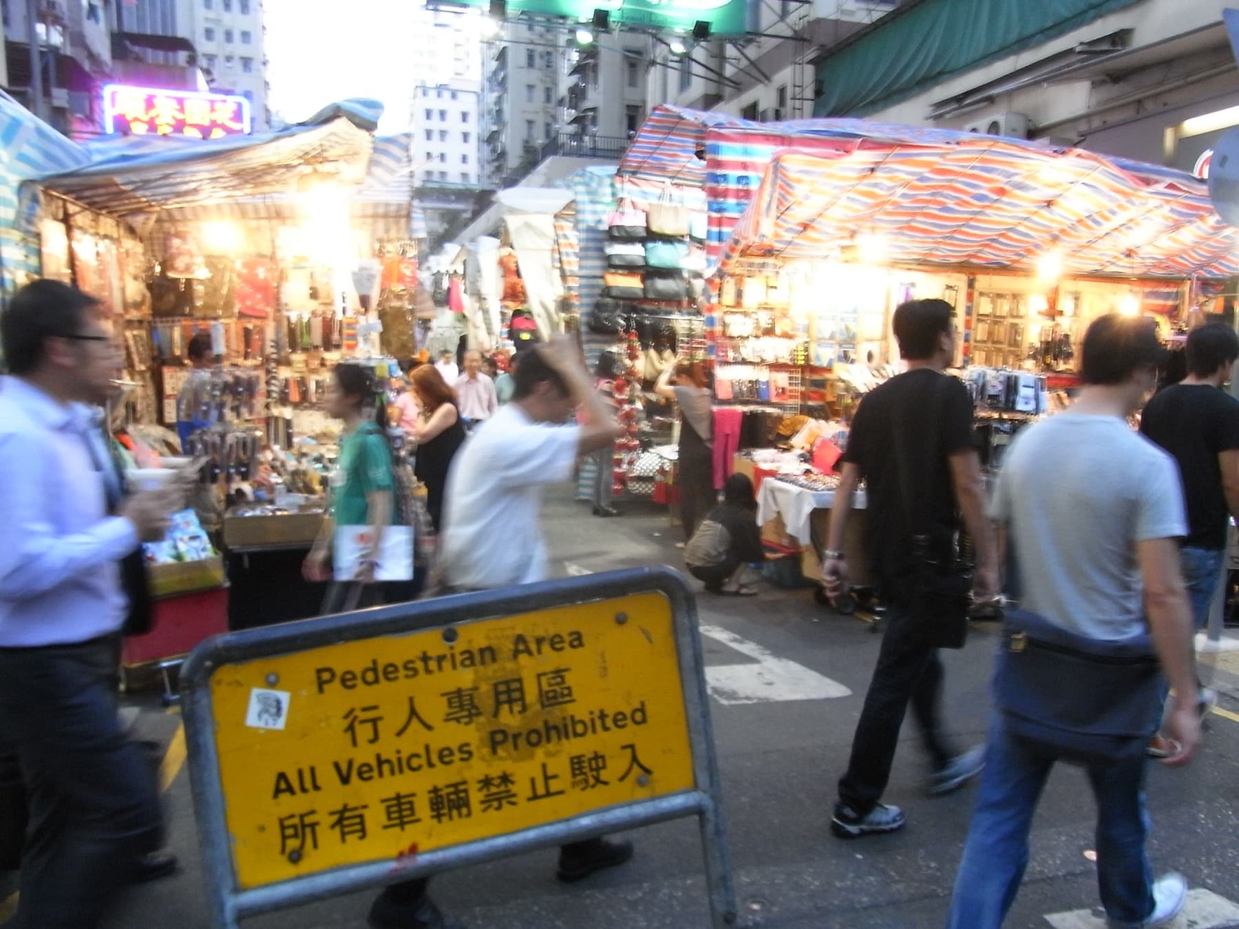 Neon storefronts and crowds fill Dundas Street and Tung Choi Street in Mong Kok at night