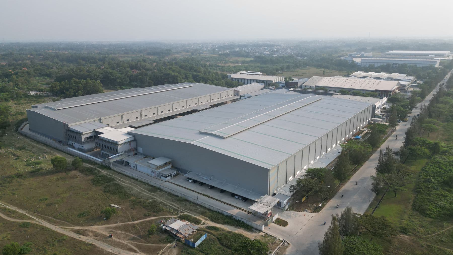 Aerial view of a modern Cella industrial logistics and cold-storage warehouse complex in Indonesia — U.S. Investor I Squared Plans Sixfold Expansion of Indonesia’s Cold-Storage Network