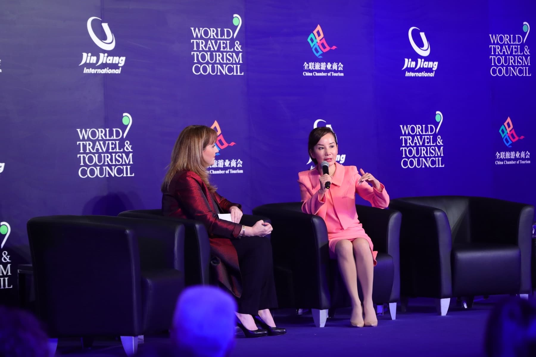 Trip.com Group chief executive Jane Sun speaking on stage at a World Travel & Tourism Council forum