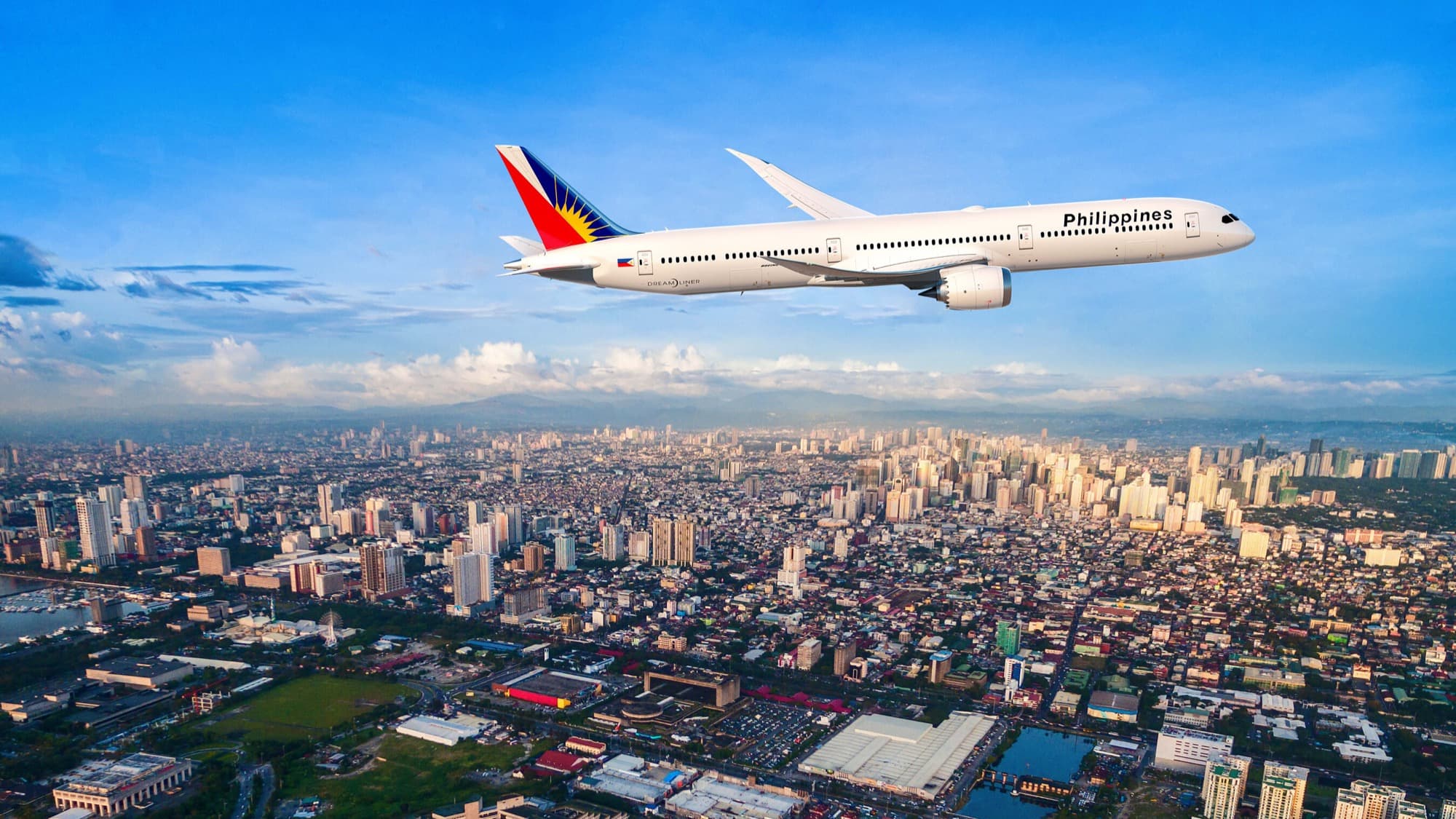 Artist’s rendering of a Philippine Airlines Dreamliner over Manila, released by Boeing with the July 20, 2026 Farnborough announcement — Philippine Airlines Returns to Boeing With Up to 20 Dreamliners