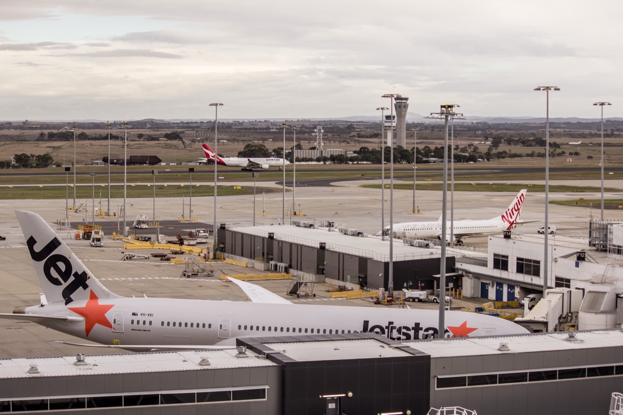 Qantas Airbus A330 at Melbourne Airport with other Australian carriers on the apron — Qantas Just Tied Itself to Melbourne’s Next Decade of Gates