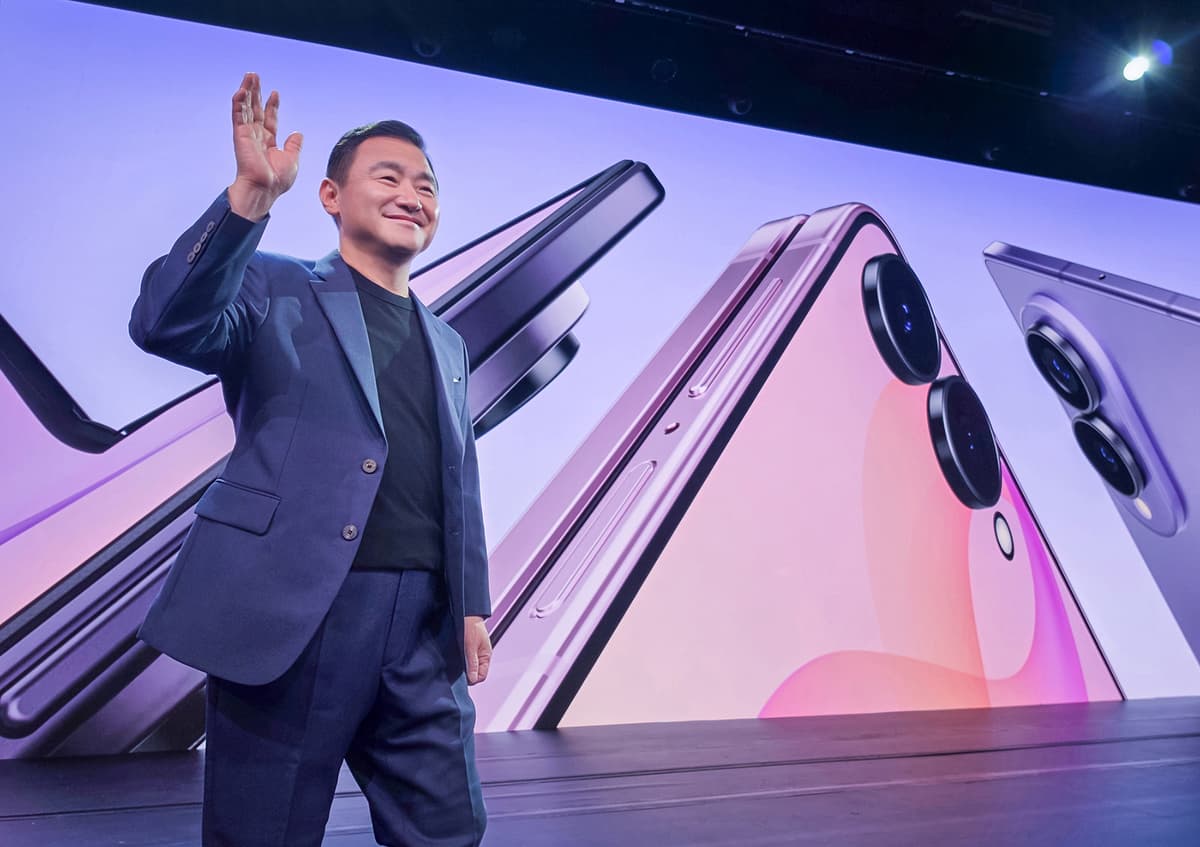 Roh Tae-moon on stage at Galaxy Unpacked July 2026 in London, with foldable phones on the screen behind him — Samsung’s Phone Boss Just Bought the Dip After DX’s First Loss