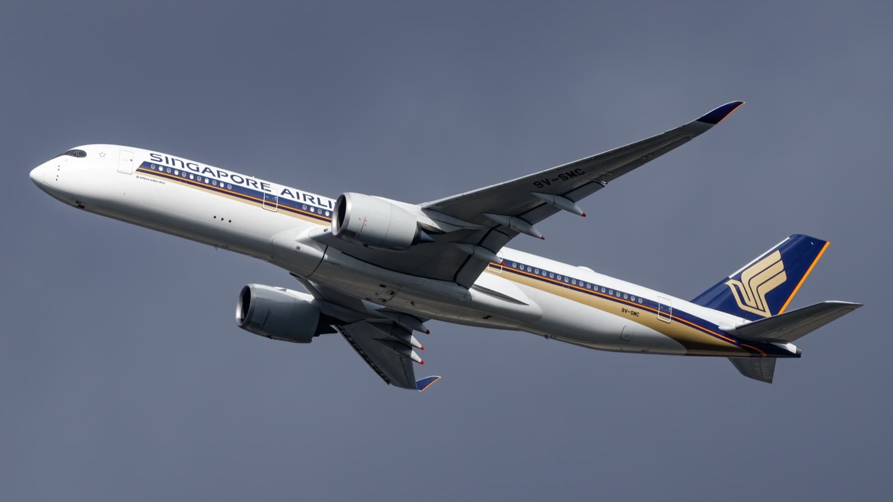 A Singapore Airlines Airbus A350-900 climbing after takeoff, landing gear still down