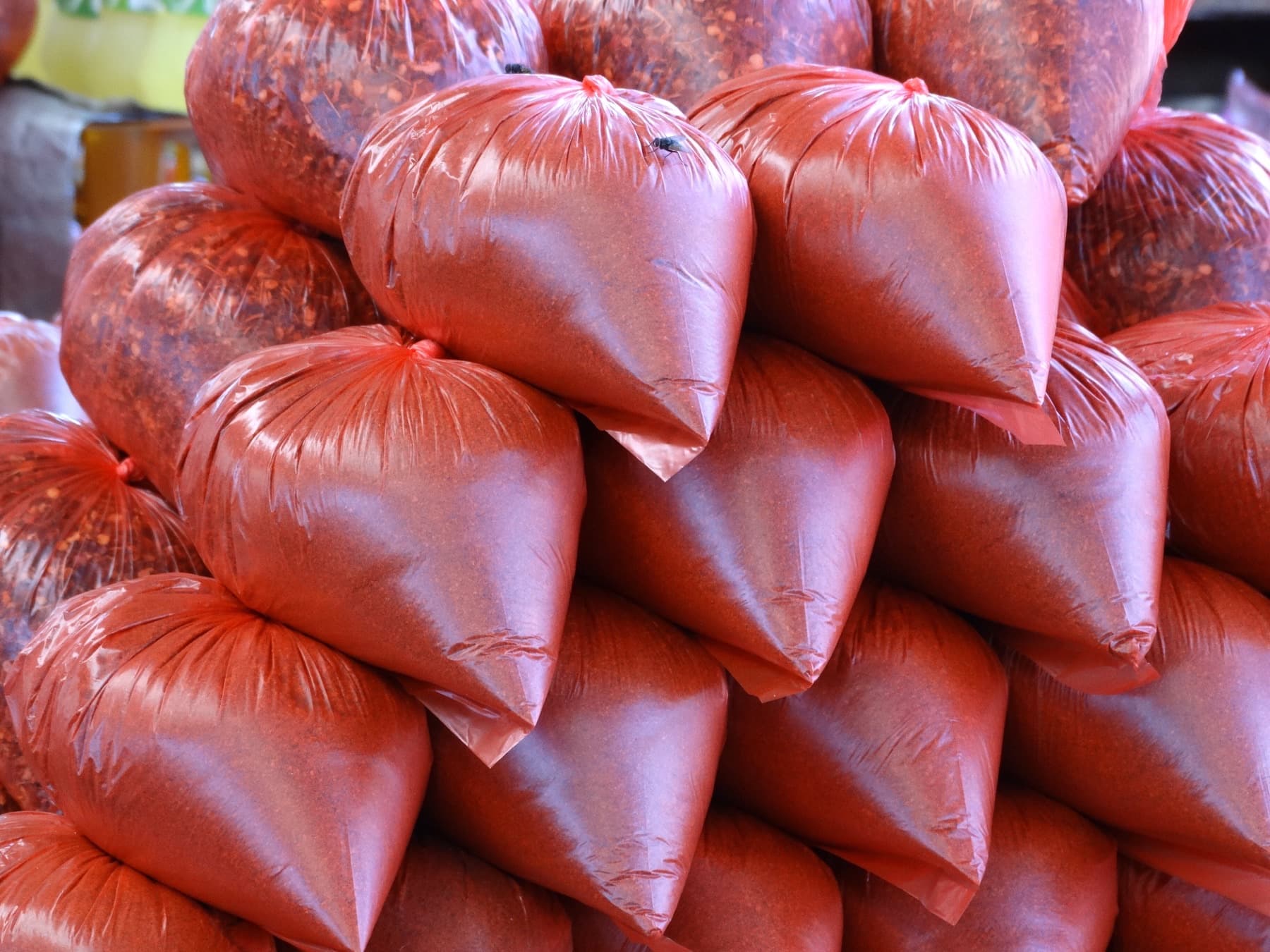 Bags of spices stacked in a Pettah market stall in Colombo