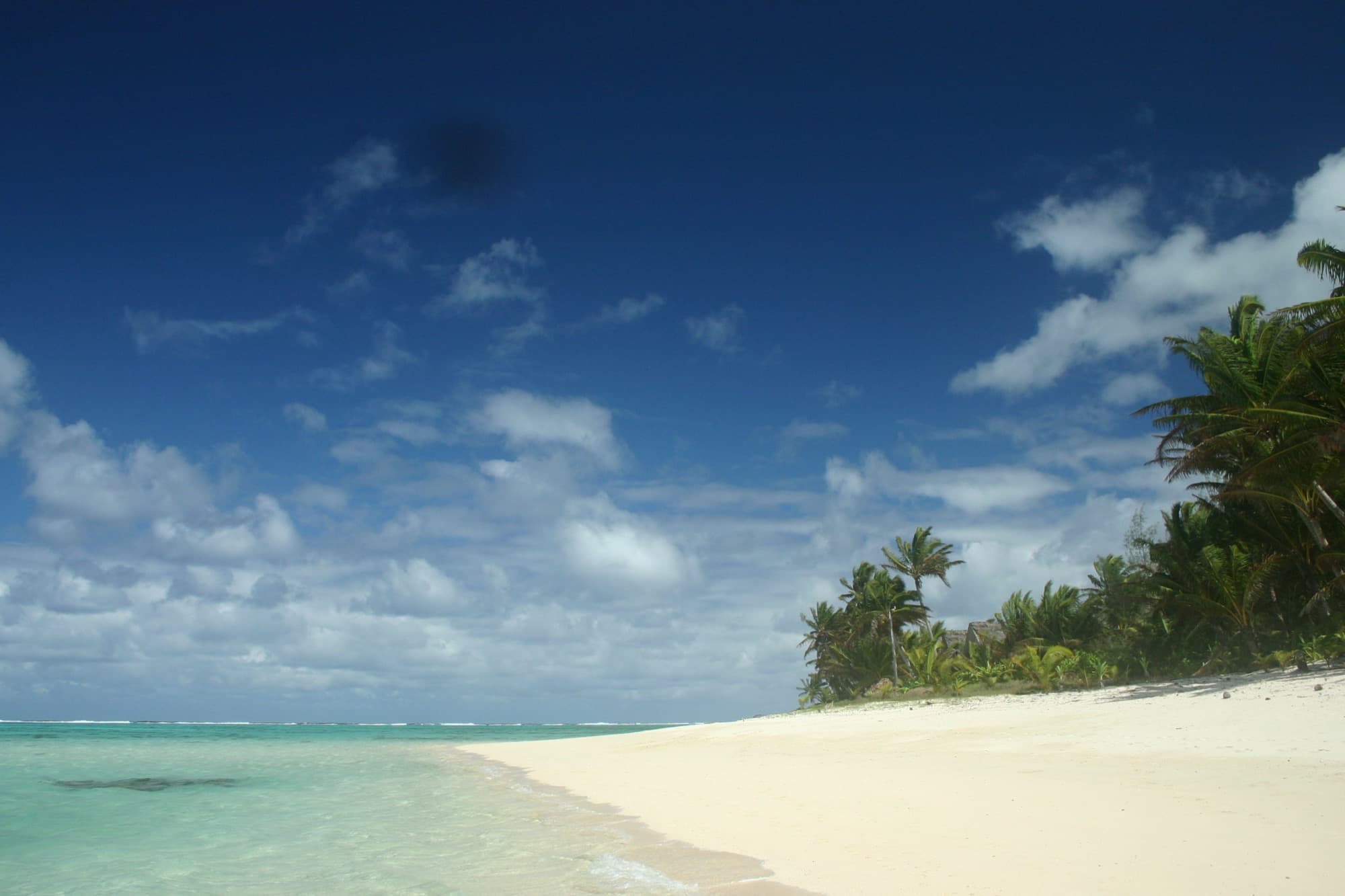 White sand and reef line at Titikaveka on Rarotonga, Cook Islands