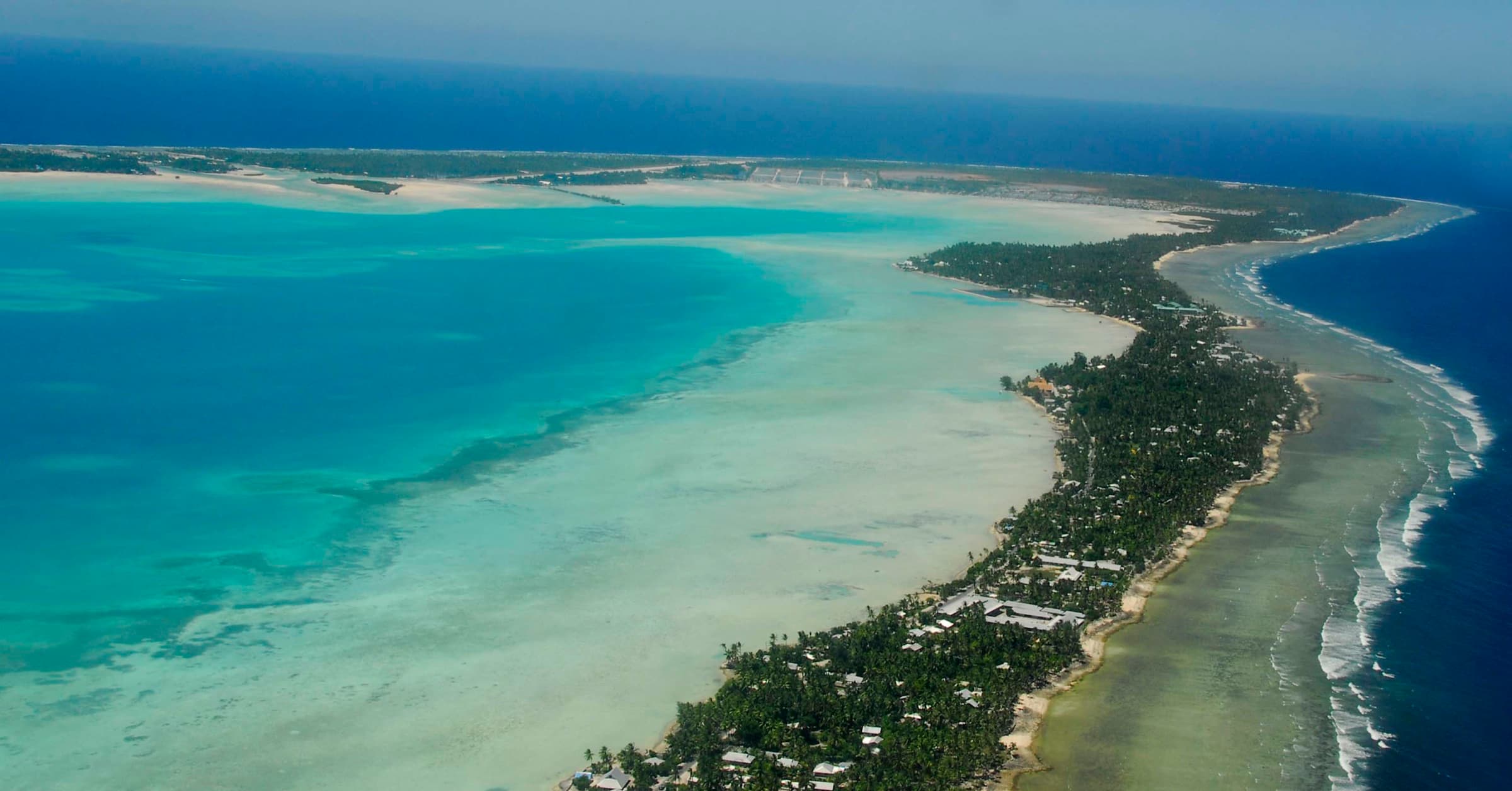 Aerial view of South Tarawa’s narrow atoll between lagoon and ocean