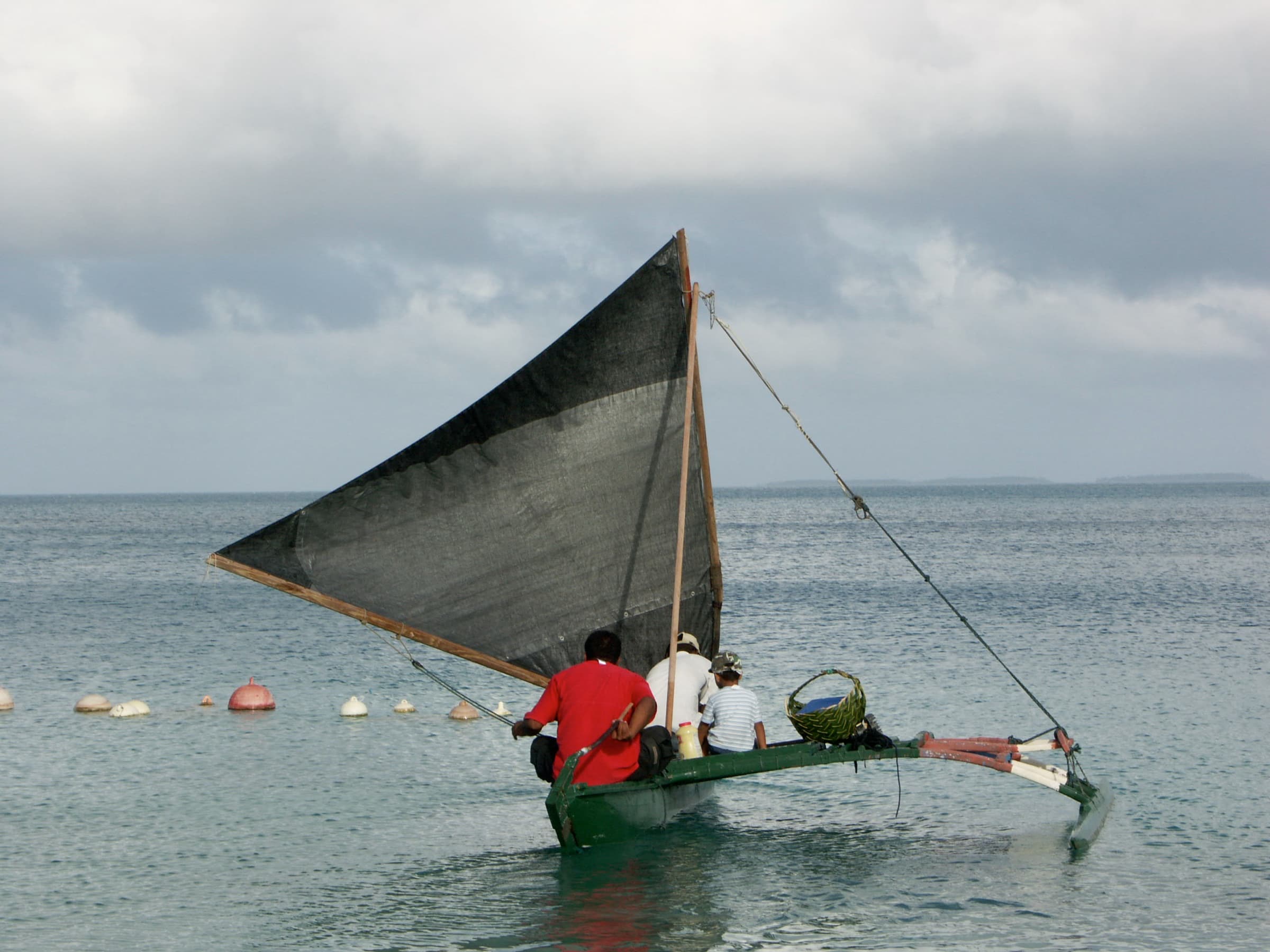 Traditional Marshallese outrigger canoe under sail