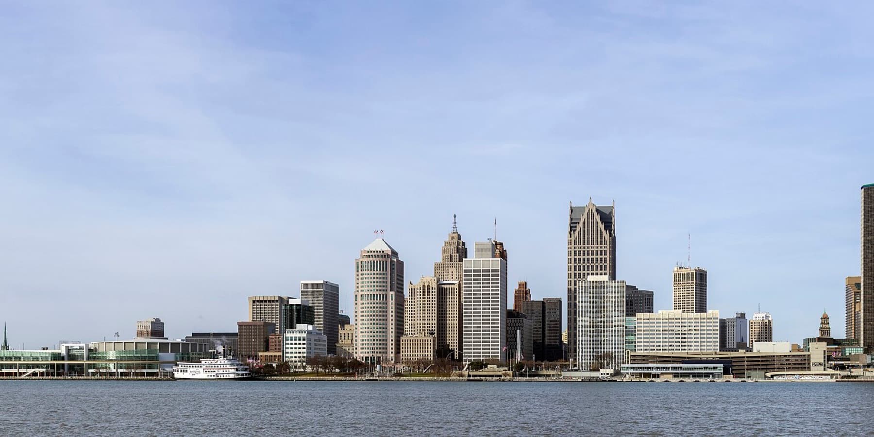 Downtown Detroit skyline across the river under a clear sky